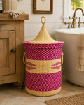 A hand woven laundry hamper with a lid.